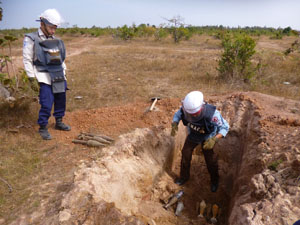 On the job training in UXO disposal skills in Cambodia.