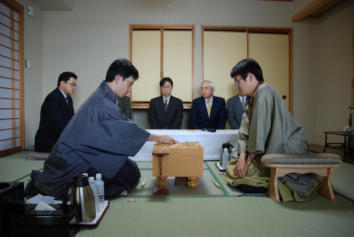 Professional players SATO Yasumitsu (left) and HABU Yoshiharu compete in the final best-of-seven games series in one of the major professional shogi tournaments. COURTESY OF JAPAN SHOGI ASSOCIATION