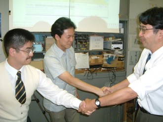 Nakasuka shook hands with project managers knowing  the success of launching XI-IV